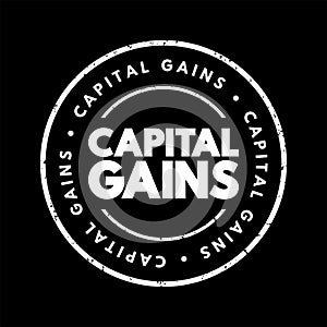Capital Gains - increase in a capital asset\'s value and is realized when the asset is sold, text concept stamp photo