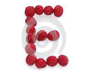 capital letter E made from raspberries. isolated on white background for birthday party