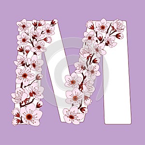 Capital letter M patterned with cherry blossom twig