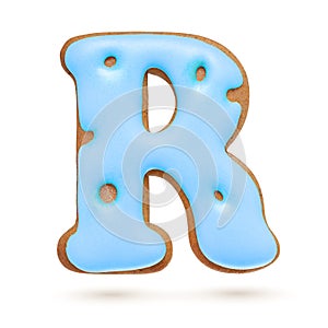 Capital letter R. Blue gingerbread biscuit isolated on white