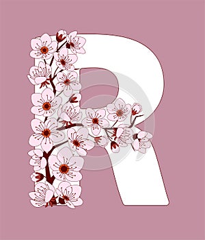 Capital letter R patterned with cherry blossom twig