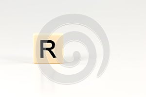 Capital letter R on plastic board isolated on white background