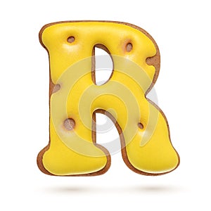 Capital letter R yellow gingerbread biscuit isolated on white