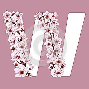 Capital letter W patterned with cherry blossom twig