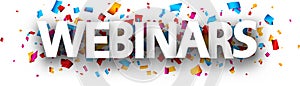 Capital letters webinars paper sign over confetti background