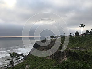 The capital of Peru Lima, a view of the beautiful, majestic Pacific Ocean from a cliff during sunset