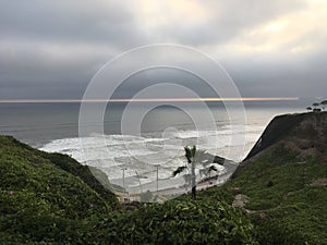 The capital of Peru Lima, a view of the beautiful, majestic Pacific Ocean from a cliff during sunset