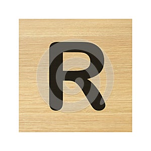 Capital R wood block on white with clipping path