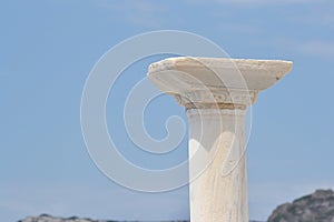 Capitel of column on blue sky background. photo