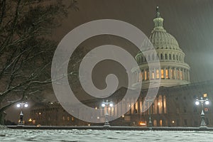 Capitol building in snow. Winter Capitol hill, Washington DC. Capitols dome in winter night snow. After the Snow photo