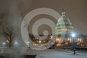 Capitol building in snow. Winter Capitol hill, Washington DC. Capitols dome in winter night snow. After the Snow photo