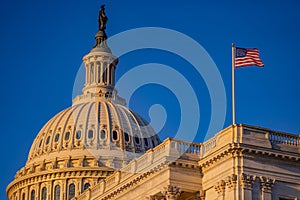 Capitol dome with flag. The US Capitol in Washington DC. Capitol Building. US National Capitol in Washington, DC