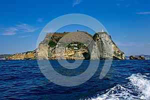 Capo Miseno, Bacoli, view from the boat with waves in the foreground.