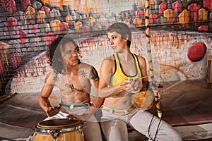 Capoeira Couple Playing Traditional Instruments