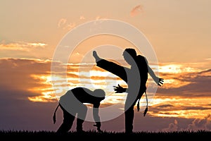 Capoeira dance at sunset