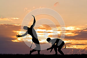 Capoeira, martial art at sunset