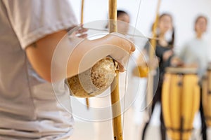 Capoeirsta Playing Berimbau in a Capoeira Roda