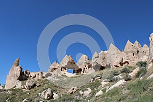 Cappadocia cave houses in tuff formations in Turkey.