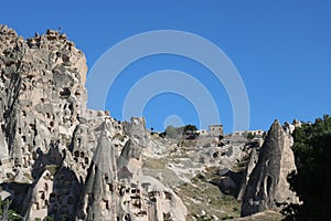 Cappadocia cave houses in tuff formations in Turkey.