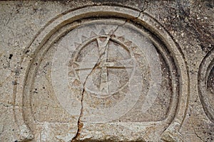 Cappadocia, Turkey - 26 August 2019 - Stone wall with historic mark carved of church in Goreme National Park, Cappadocia, Turkey.