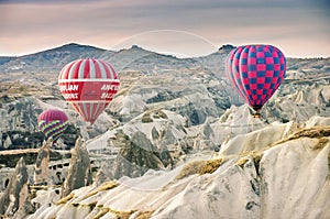 Hilly landscape and balloon. Balloons. Goreme, Cappadocia - Landmark attraction in Turkey