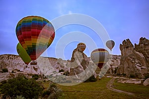 Cappadocia, Turkey - JUNE 01,2018: Festival of Balloons. Flight on a colorful balloon between Europe and Asia. Fulfillment of desi