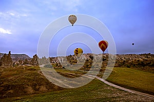 Cappadocia, Turkey - JUNE 01,2018: Festival of Balloons. Flight on a colorful balloon between Europe and Asia. Fulfillment of desi