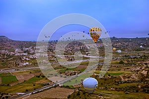 Cappadocia, Turkey - JUNE 01,2018: Festival of Balloons. Flight on a colorful balloon between Europe and Asia. Fulfillment of desi