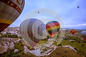 Cappadocia, Turkey - JUNE 01,2018: Festival of Balloons. Flight on a colorful balloon between Europe and Asia. Fulfillment of desi