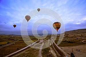 Cappadocia, Turkey - JUNE 01,2018: Festival of Balloons. Flight on a colorful balloon between Europe and Asia. Fulfillment of desi