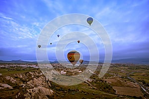 Cappadocia, Turkey - JUNE 01,2018: Festival of Balloons. Flight on a colorful balloon between Europe and Asia. Fulfillment of desi