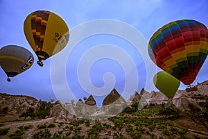 Cappadocia, Turkey - JUNE 01,2018: Festival of Balloons. Flight on a colorful balloon between Europe and Asia. Fulfillment of desi