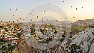 CAPPADOCIA, TURKEY - MAY 04, 2018: Hot air balloon flying over rock landscape at Cappadocia Turkey.