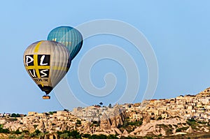 CAPPADOCIA, TURKEY - MAY 04, 2018: Hot air balloon flying over rock landscape at Cappadocia Turkey.