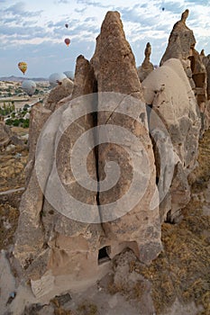 Cappadocia, Turkey - September 1, 2021 - Cappadocia Panoramic - Hot air balloon flying in early morning over rock landscape at