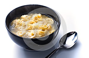 Cappelletti Soup in a black bowl