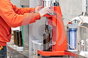 capping beer bottles in a brewery
