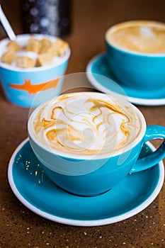 Cappuccino in Big Blue Cups in Modern Vegan Cafe