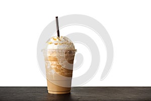 Cappuccino blended in plastic cup. Served with whipped cream. Refreshment drink. Favorite caffeine beverage