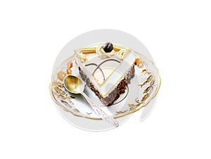 Cappuccino cake with chocolate biscuit and butter cream on a plate isolated