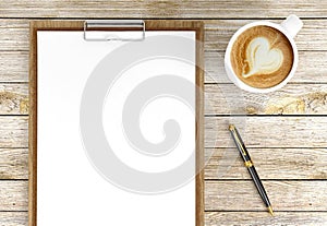 Cappuccino coffee cup with blank papers on clipboard and ballpoint pen, coffee and business background