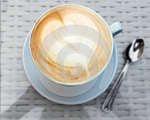 Cappuccino coffee cup with heart design
