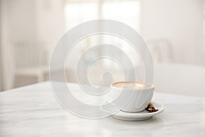 Cappuccino coffee cup on white marble table