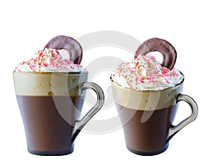 Cappuccino coffee in a glass mug with whipped cream, decorated with red, purple, green pastry balls. A circle of chocolate in crea