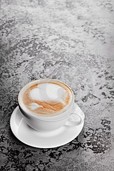 Cappuccino coffee on gray table background
