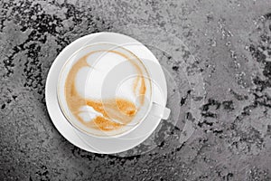 Cappuccino coffee on gray table background
