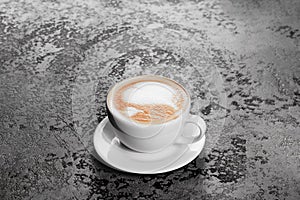 Cappuccino coffee on gray table background