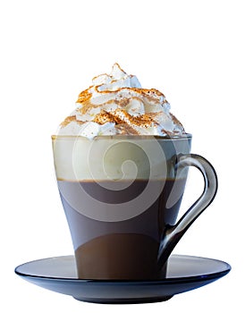 Cappuccino coffee, with whipped cream and ground cinnamon in a glass mug, on a saucer. Isolate on a white background.