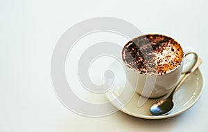 Cappuccino coffee in white cup isolated on white background