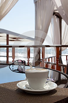 Cappuccino cup on the table in a cafe